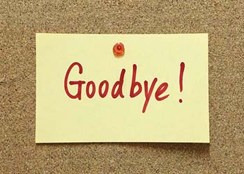 A "Goodbye" note tacked to a cork board.