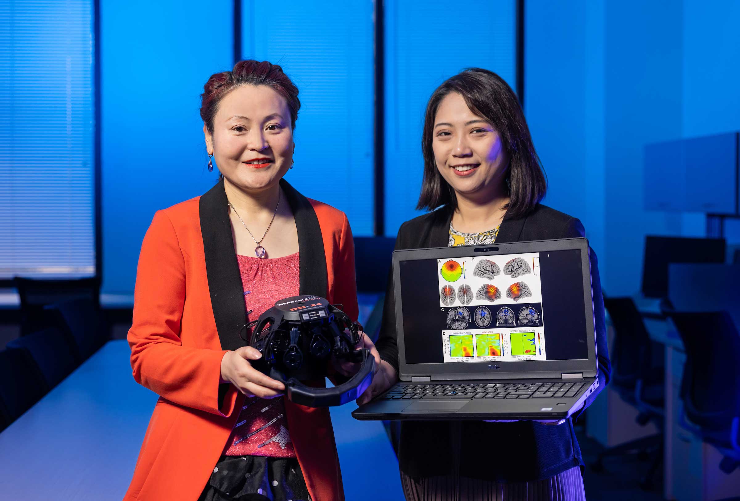 Selena He and Shirley Tian accepting grant award for research experience