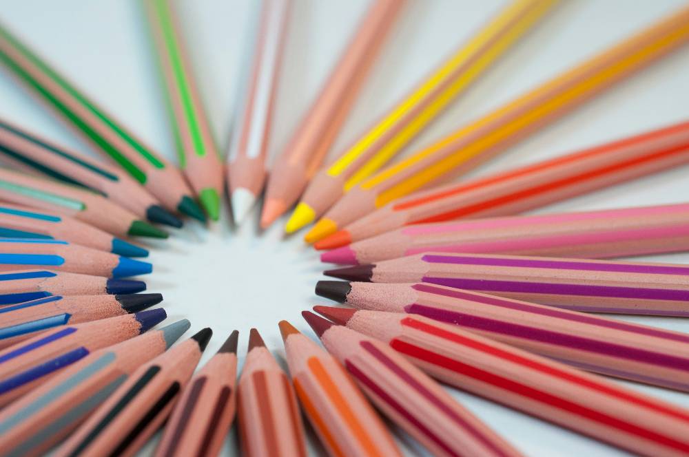 circle of colored pencils in rainbow of colors