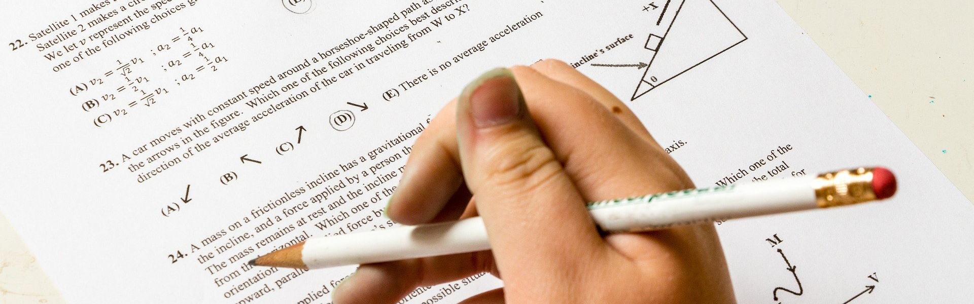 close up of someone doing homework with pencil
