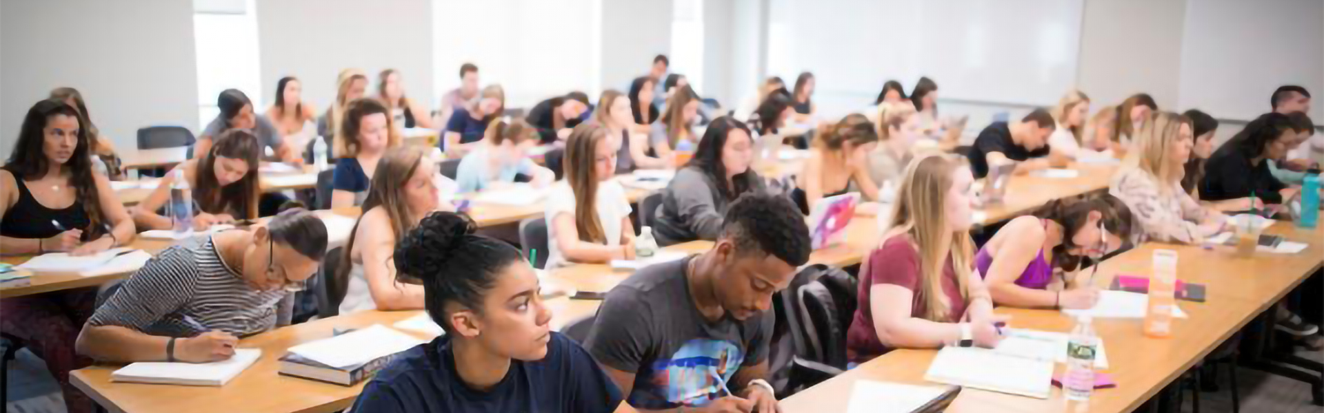 mix group of students in a full classroom