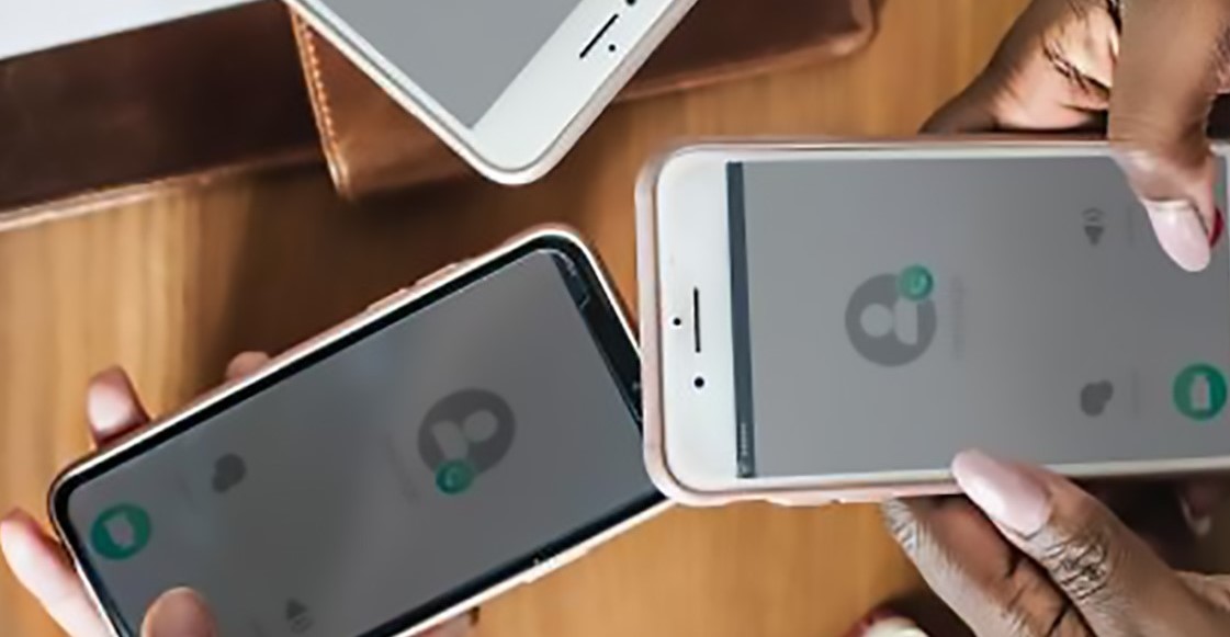 Two people holding smartphones