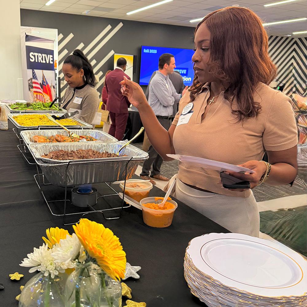 A STRIVE student getting lunch during graduation.  / 