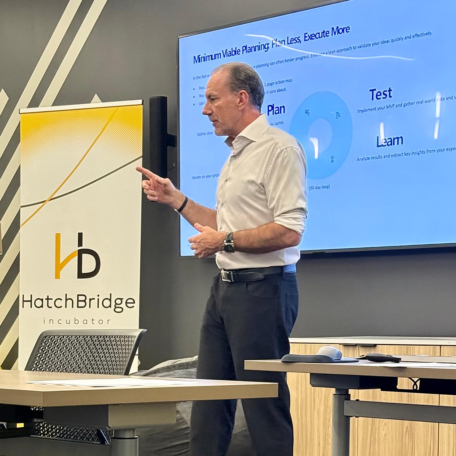 A STRIVE instructor stands in front of a classroom / 