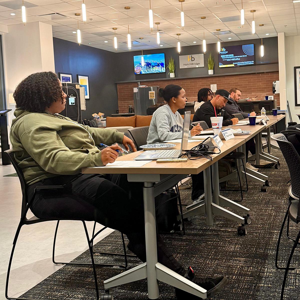 A group of STRIVE students in a class room / 