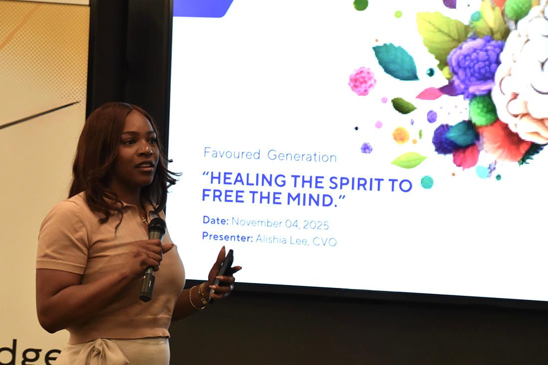 A STRIVE student gives a presentation in front of a power point slide. / 