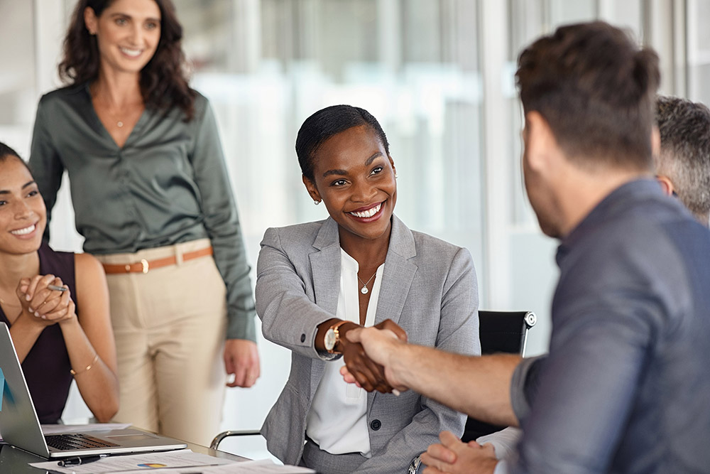 photo of two people shaking hands