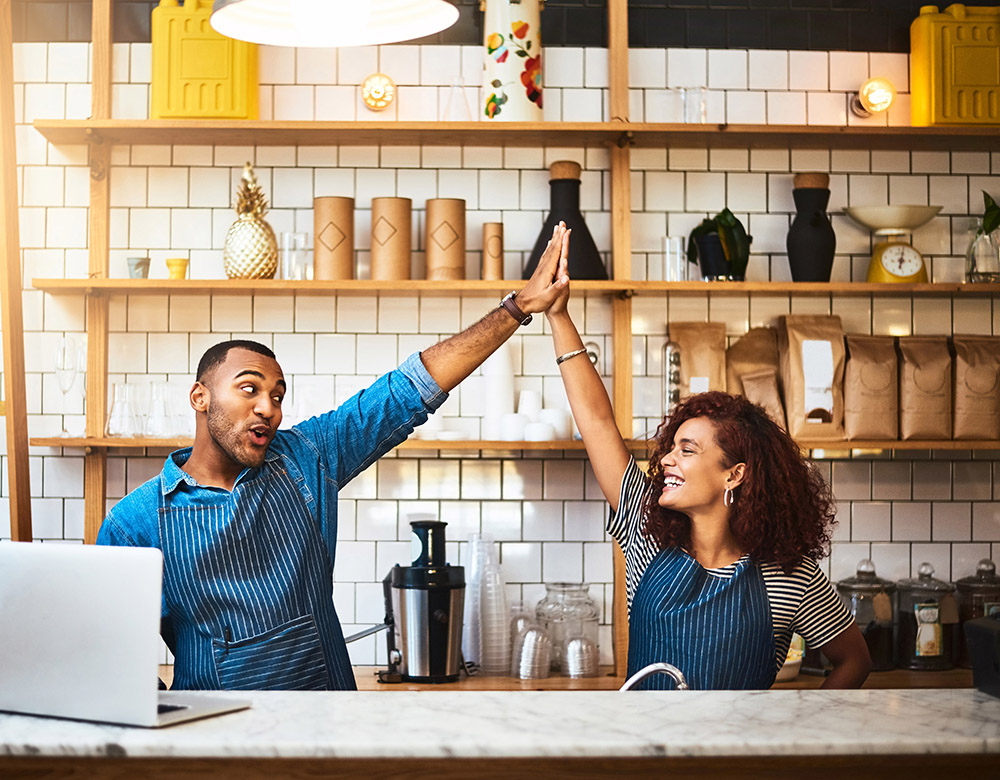 2 people giving in a high five