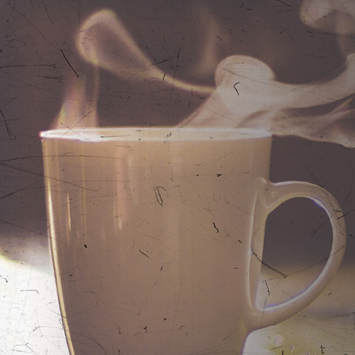 a steaming cup of coffee