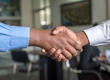 photo of two men shaking hands