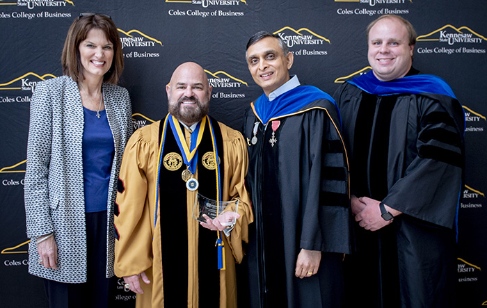coles Business Administration faculty posing togeter at commencement ceremony