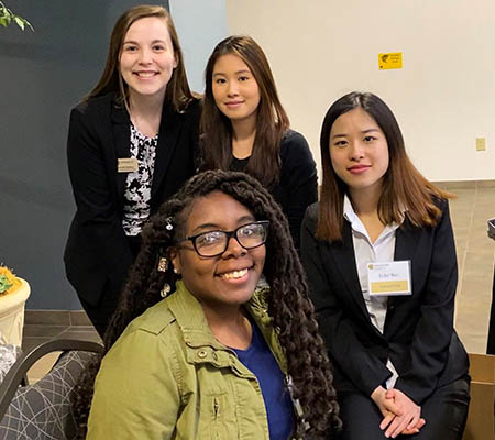 group of female coles school of business students posing together