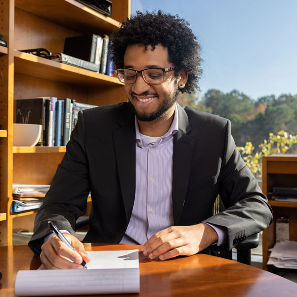 coles Management, Entrepreneurship and Hospitality student working at desk