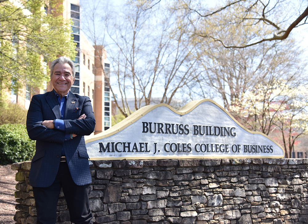 Michael J Coles standing in front of KSU College of Business