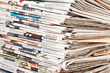 a photo of a stack of newspapers