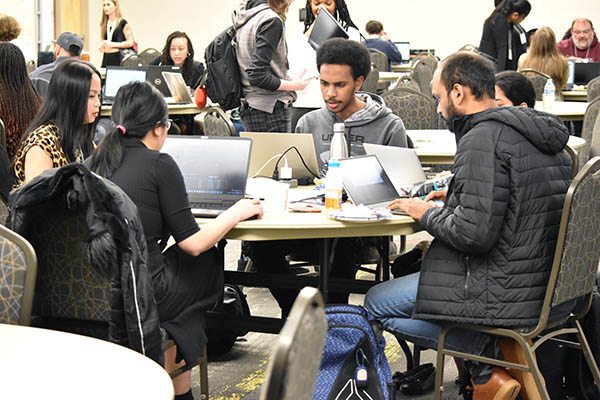 a group of students at the Coles College hackathon