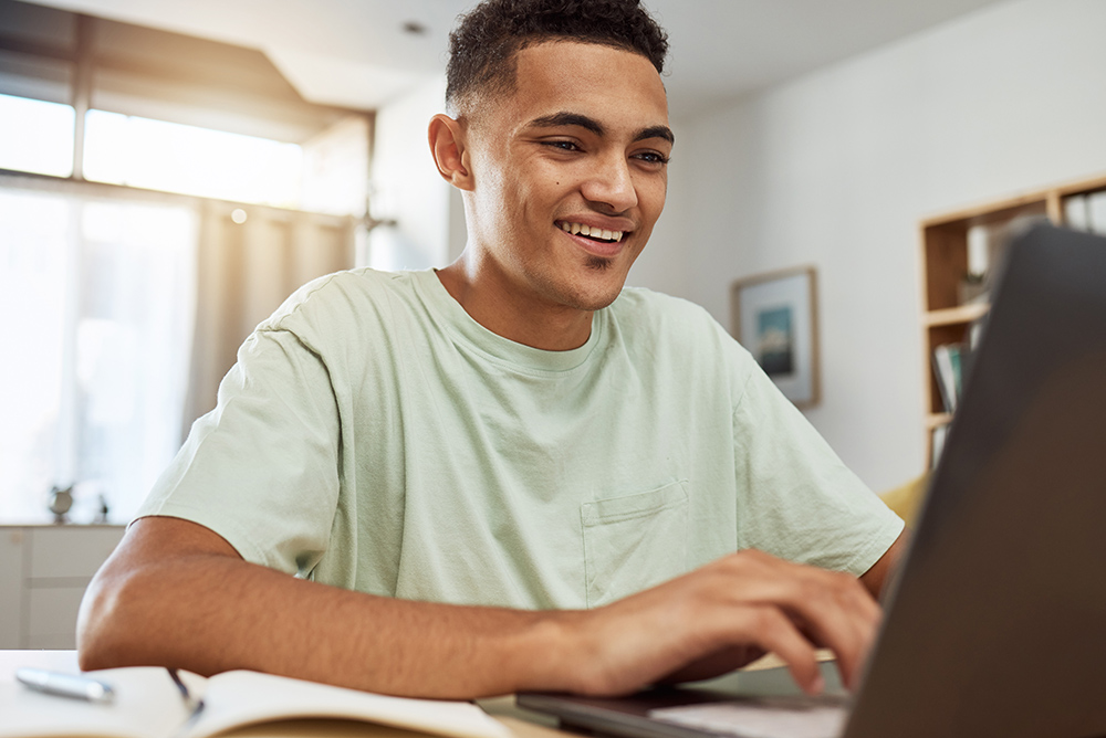 Online learner working at a laptop computer