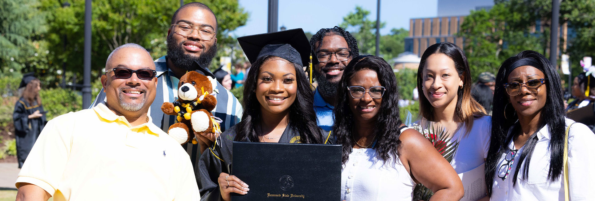 KSU graduate student with family and friends