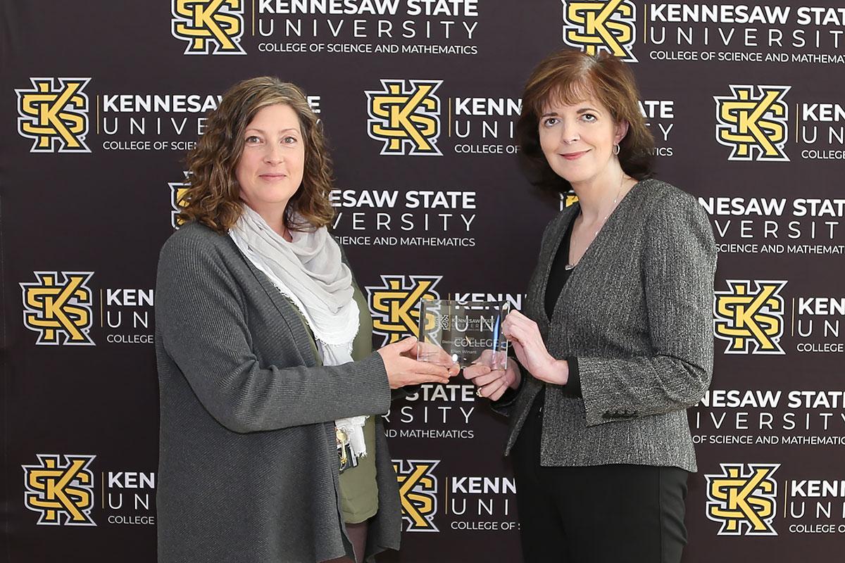  / Photo of the Distinguished Staff Award winner, Ellen Winant, Grants and Contracts Manager, (left) and Dr. Marla Bell, Interim Dean (right)