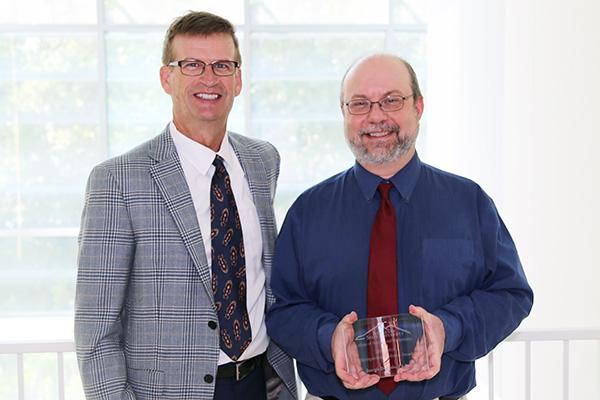  / Photo of Mark Anderson (left) and Distinguished Professor Award recipient, Joseph DeMaio, Ph.D.,(right) Director of the Masters of Applied Statistics and Professor of Mathematics and Data Science (STAT)