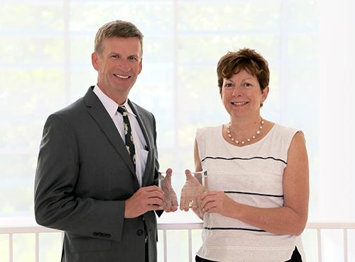  / Photo of Mark Anderson (left) and Distinguished Scholarship Award recipient, Susan Smith, Ph.D., (right) Professor of Biology, Department of Molecular and Cellular Biology.