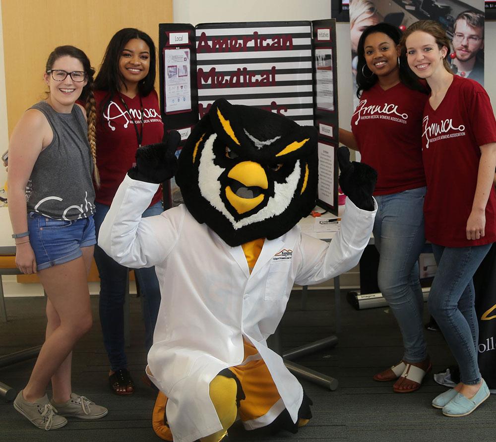  / Scrappy and American Medical Women's Association students at the Advanced Majors Program (AMP) Backstage Pass event on August 16, 2018