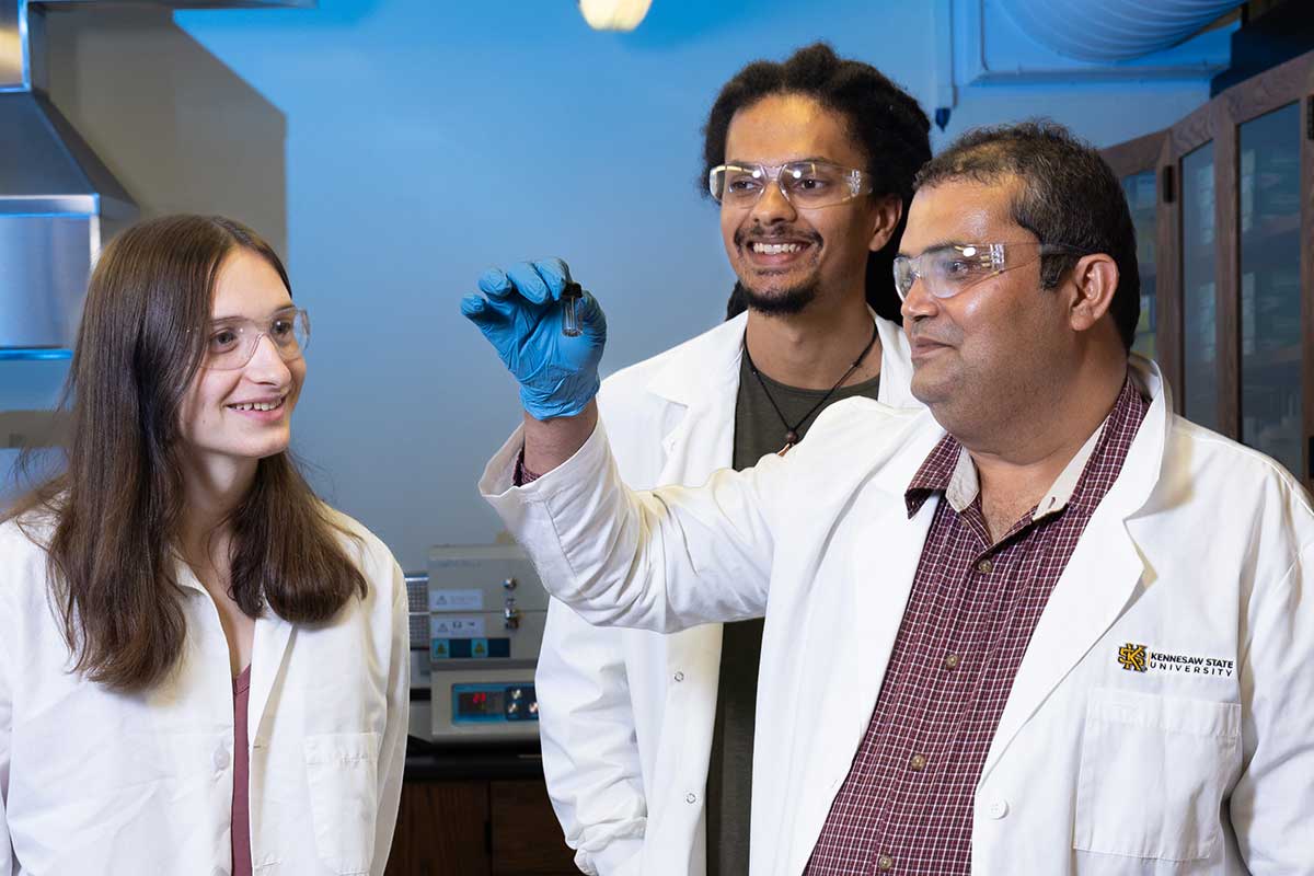 Dr. Chetan Dhital working on research with physics students. / Dr. Chetan Dhital working on research with physics students.