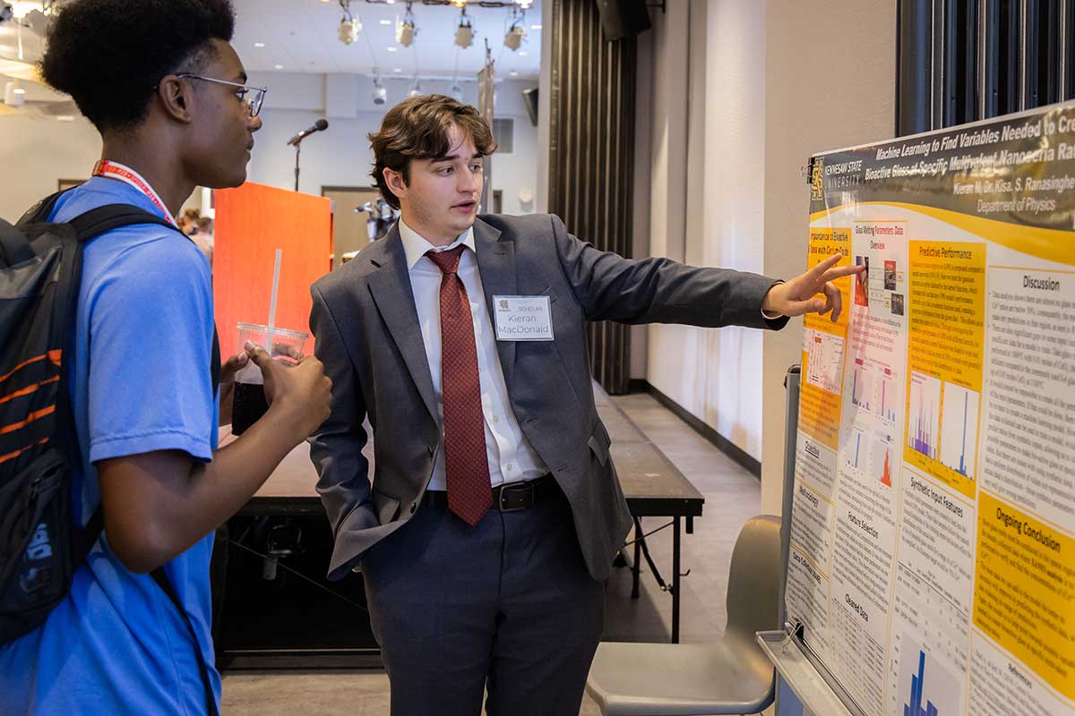 Birla Carbon Scholars physics student presenting research at a symposium. / Birla Carbon Scholars physics student presenting research at a symposium.