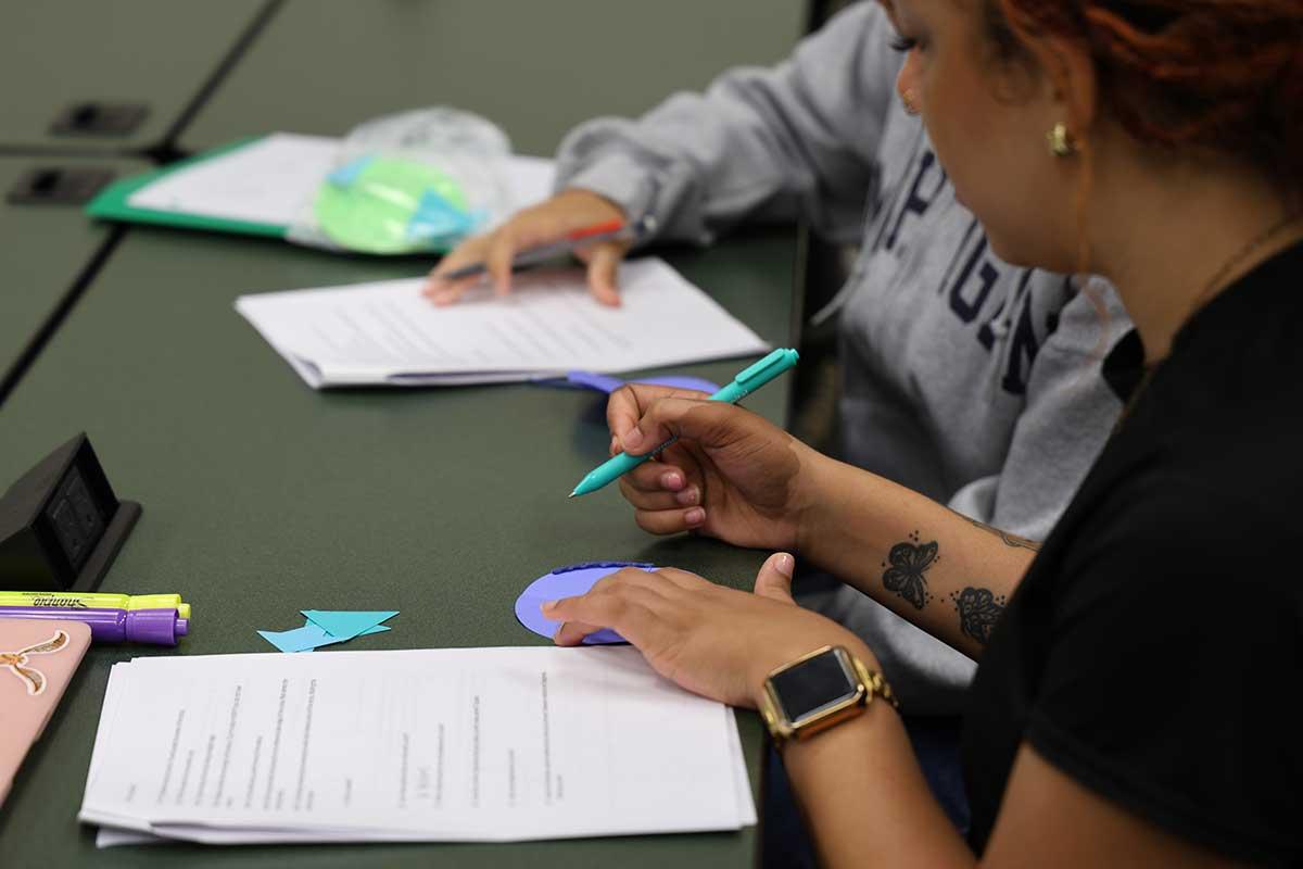 CSM PRESS program students engaged in focused work participating in a classroom activity. / CSM PRESS program students engaged in focused work participating in a classroom activity.