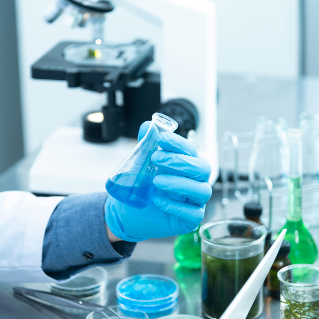 scientist holding experiment in biochemistry lab