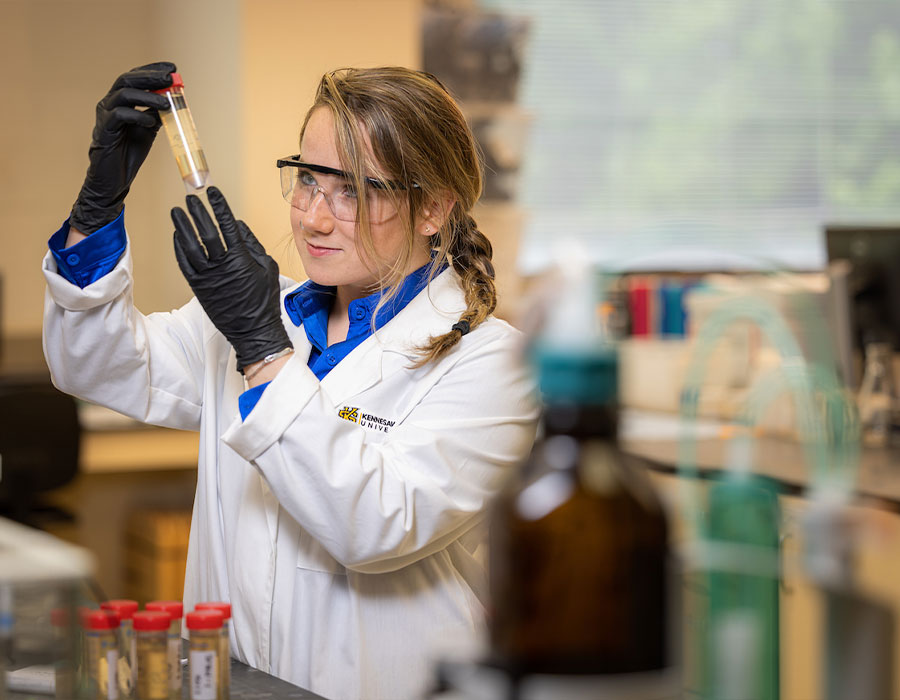 ksu biology student in a lab doing research