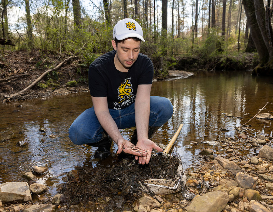 ksu student researching in stream