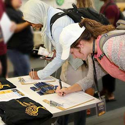 Photo of KSU Students signing up for the Biology student organization