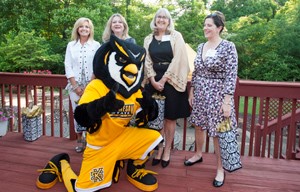 Group of people with Scrappy the Owl