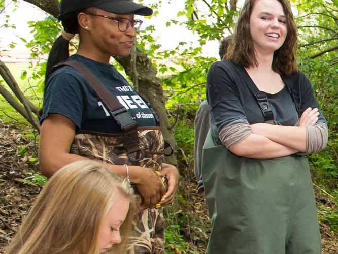 Group of students outdoors having a conversation