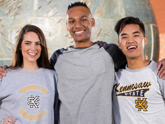 Group of students standing together and smiling for picture