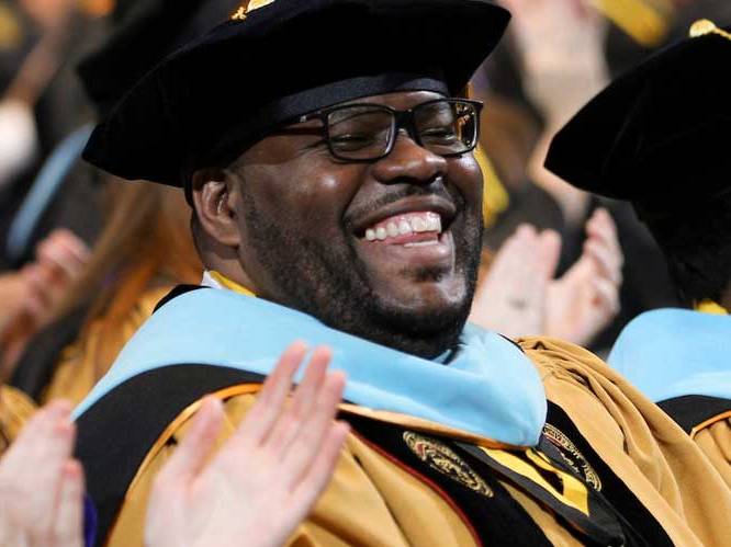 Student is smiling at graduation