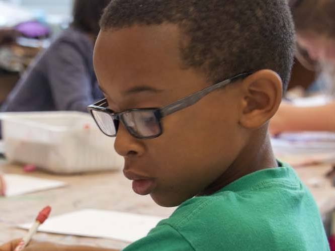 Young child working on school work