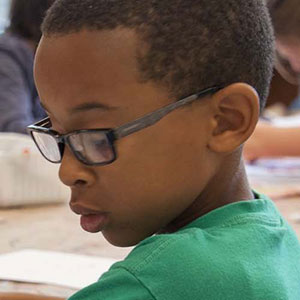 Young student focusing on school work