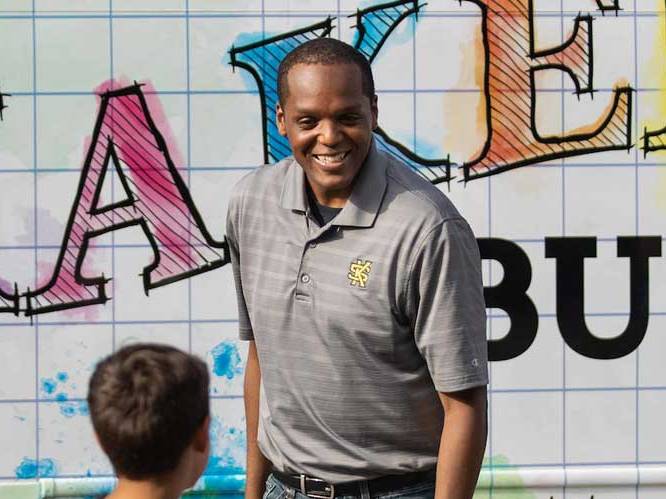 Teacher smiling at student