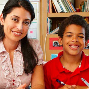 Teacher and student smiling for a picture