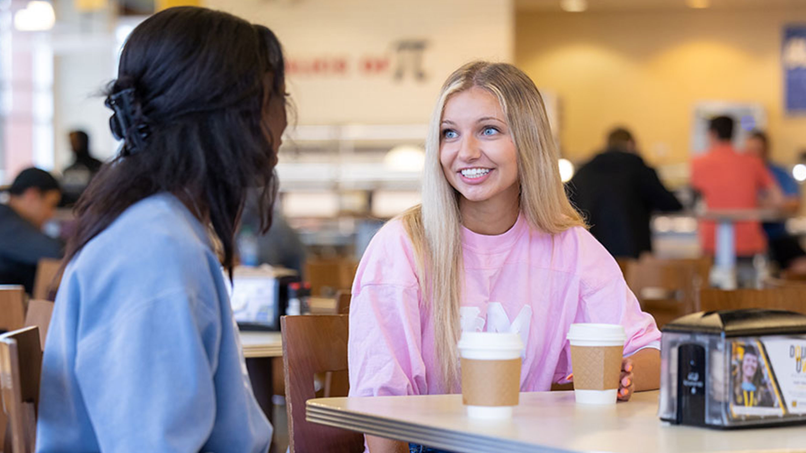 Students drinking coffee in Stingers dining hall