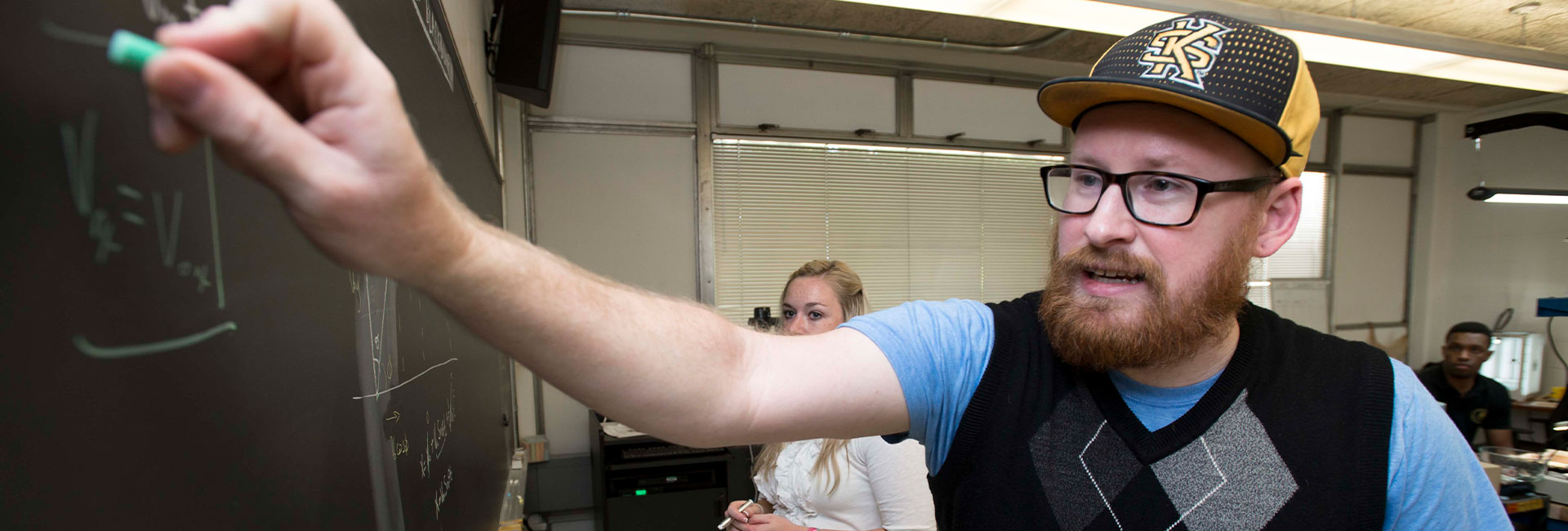 Teacher writing on board