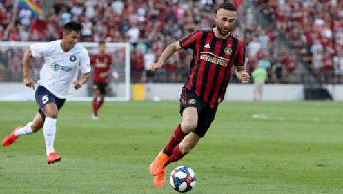 Atlanta United soccer player scoring a goal at KSU's Fifth Third Stadium. 