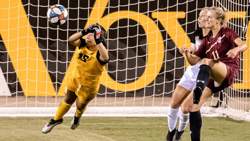 A photo of KSU soccer player blocking a goal for the team at KSU's Fifth Third Stadium.