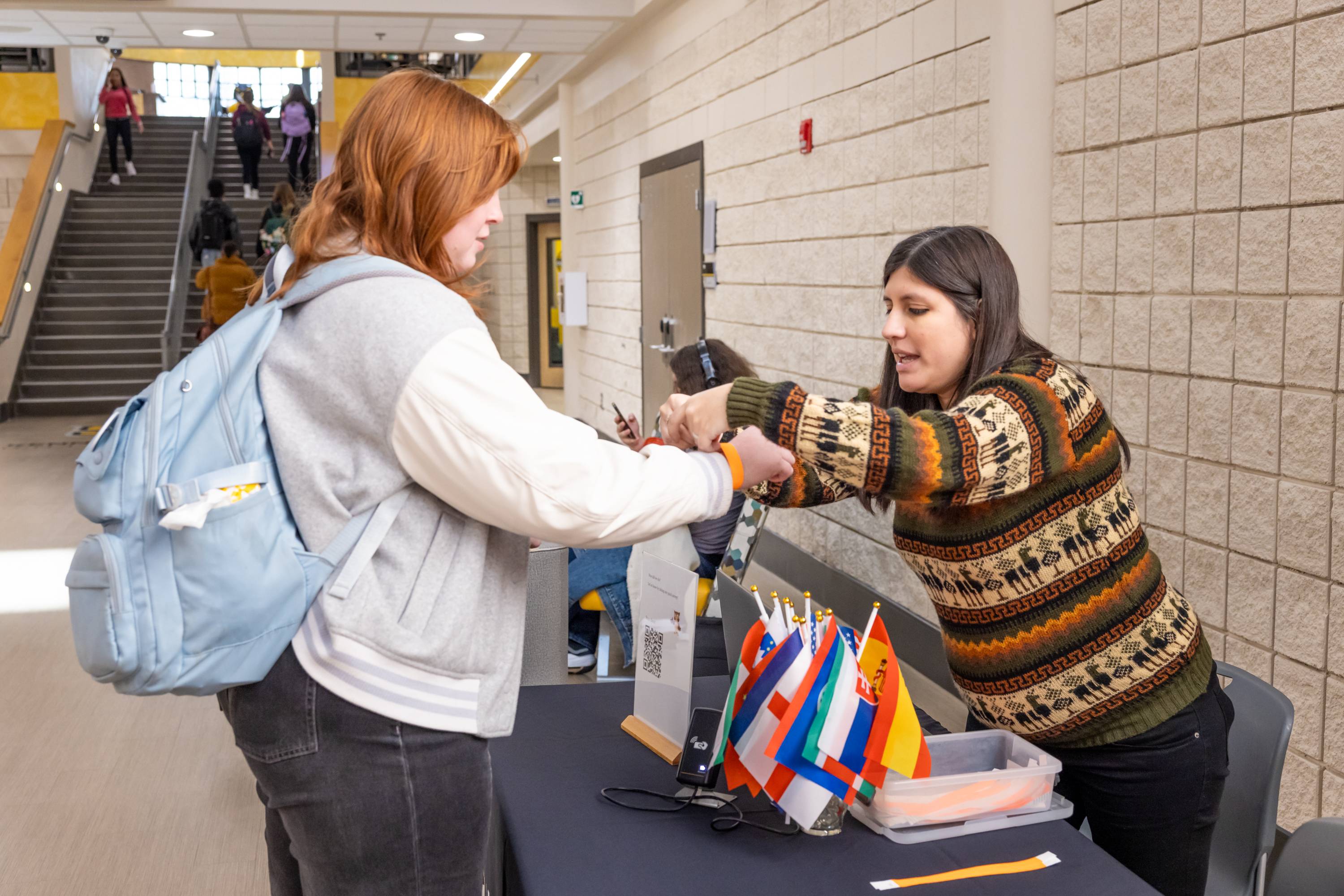 two women at a check in table