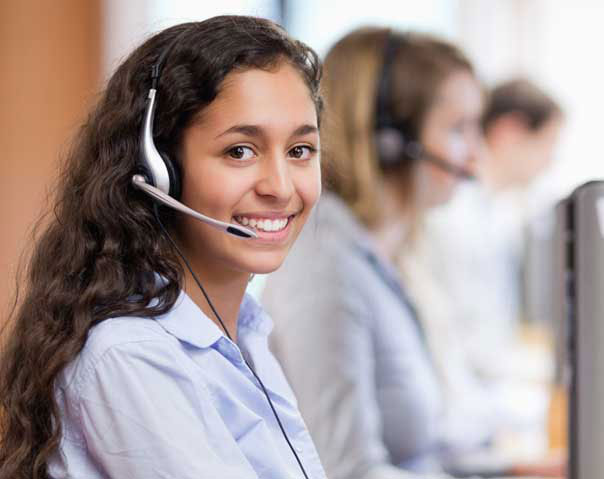young woman wearing headset in a call center