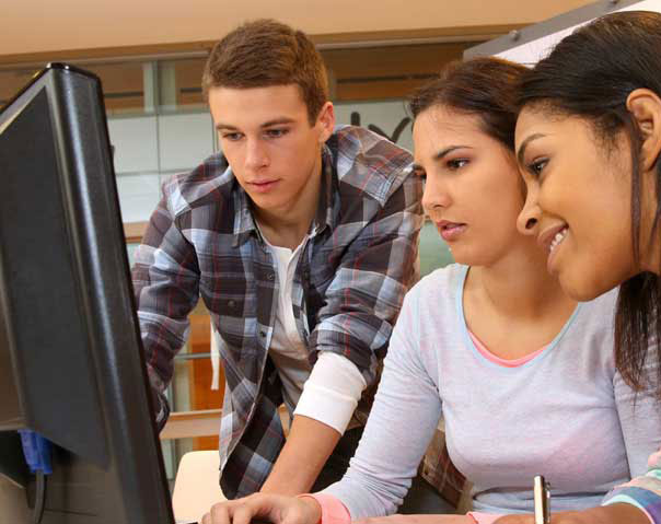 ksu students gathered around computer