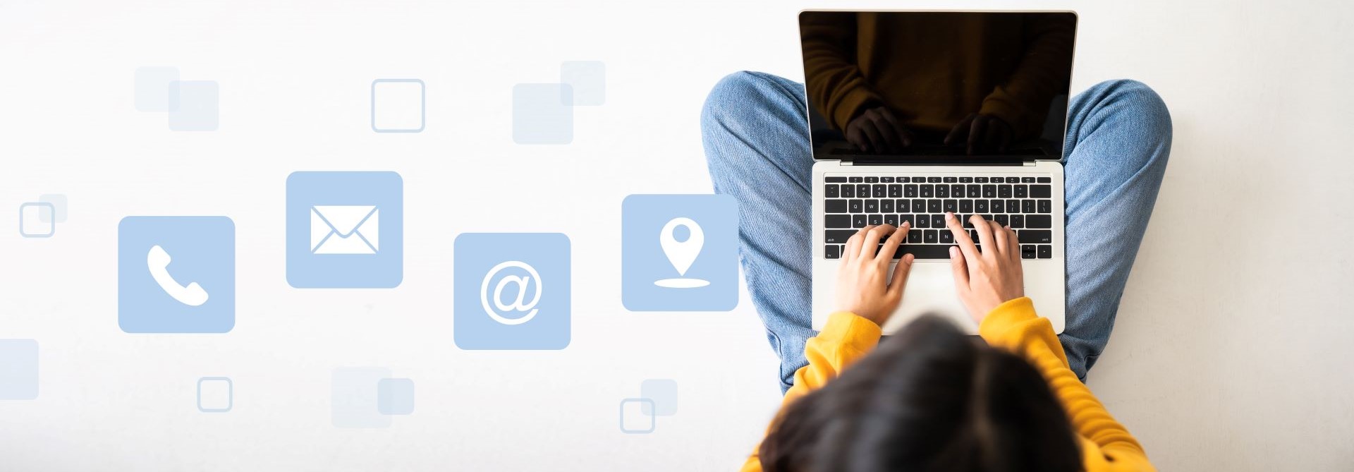Top View of woman sitting on the floor and using a laptop