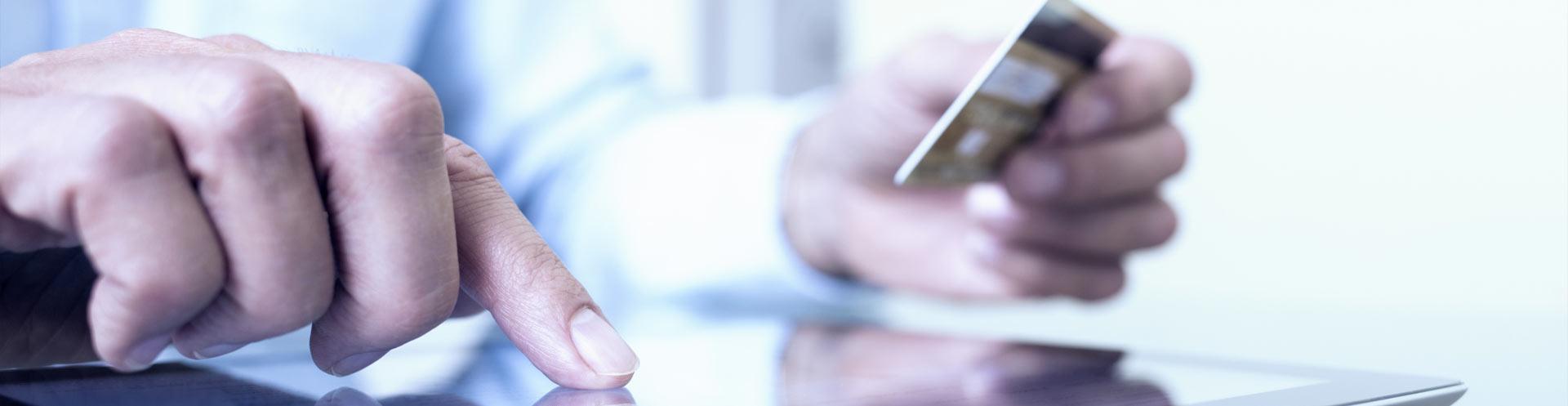 Person looking at a credit card.